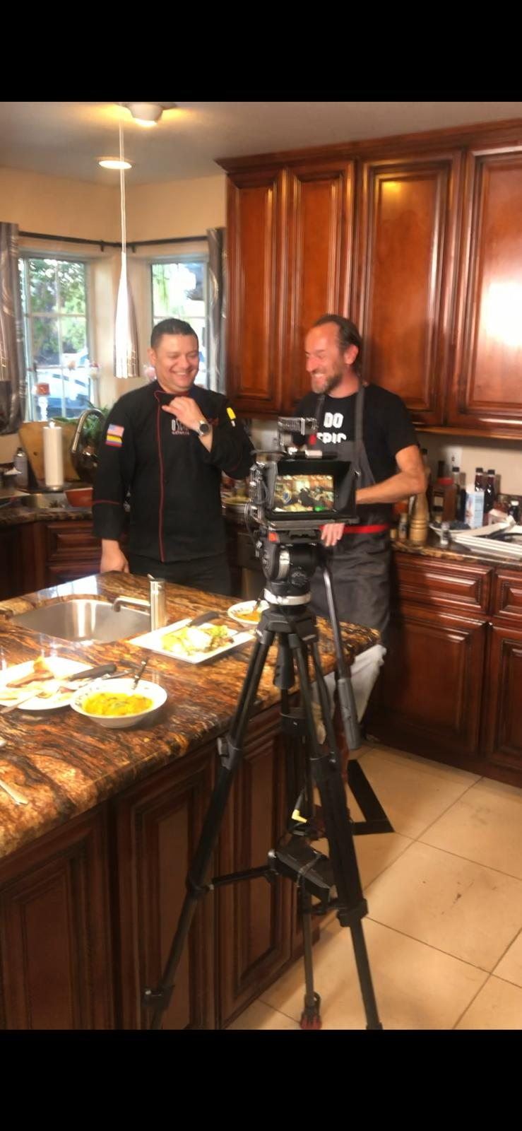 Chef Oscar filming a cooking feature in a residential kitchen