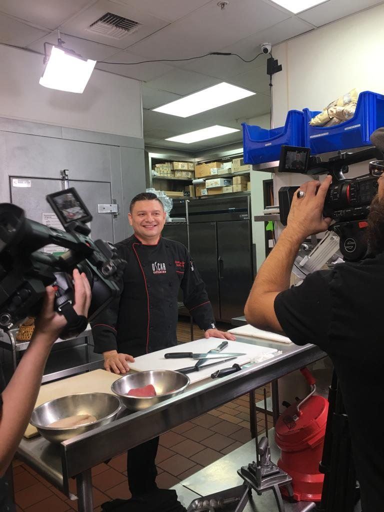 Chef Oscar being filmed in a commercial kitchen