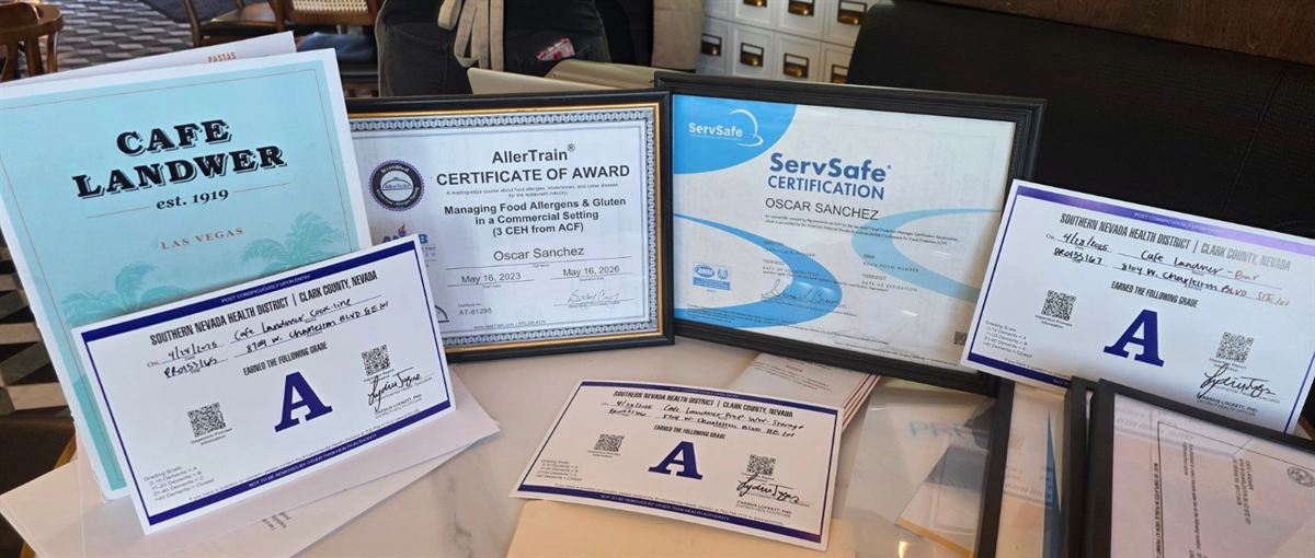 ServSafe and allergen certification awards displayed for Oscar Sanchez