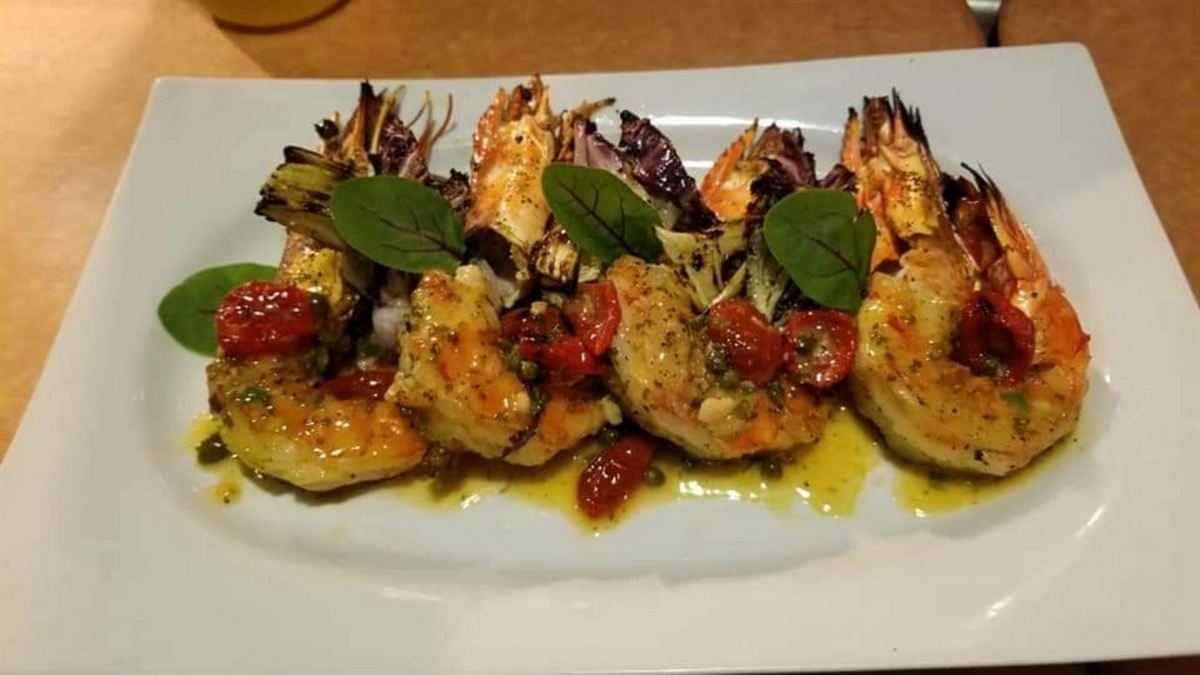 Grilled shrimp plated with vegetables