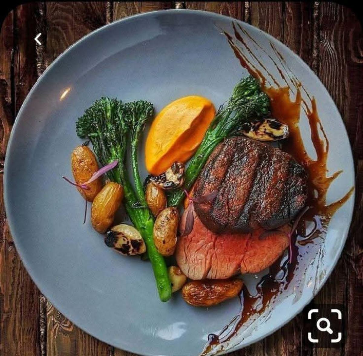 Plated steak with broccolini and citrus