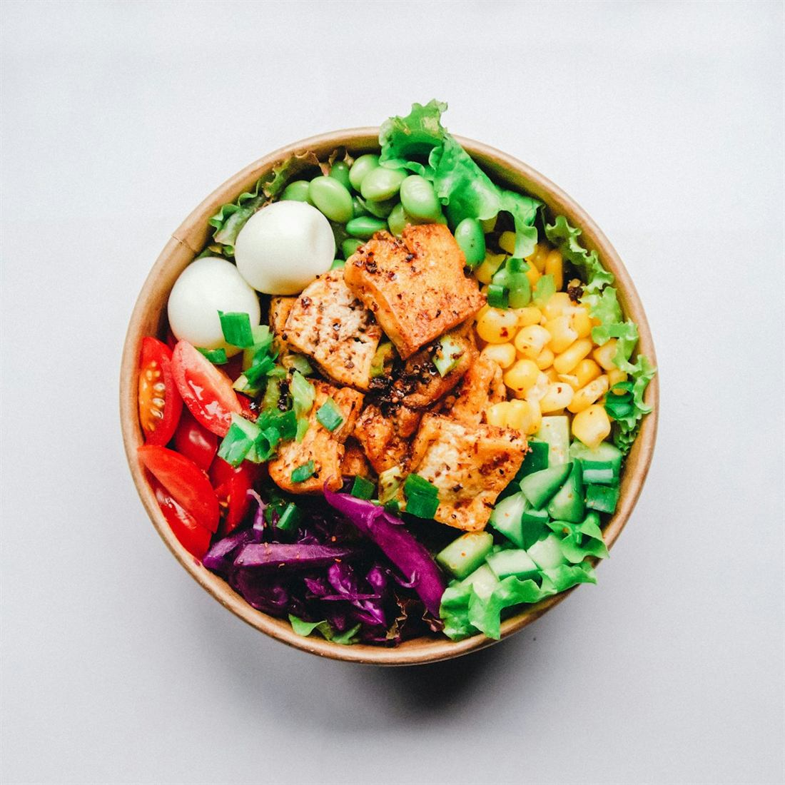 Health-conscious bowl of grilled protein, grains and vegetables